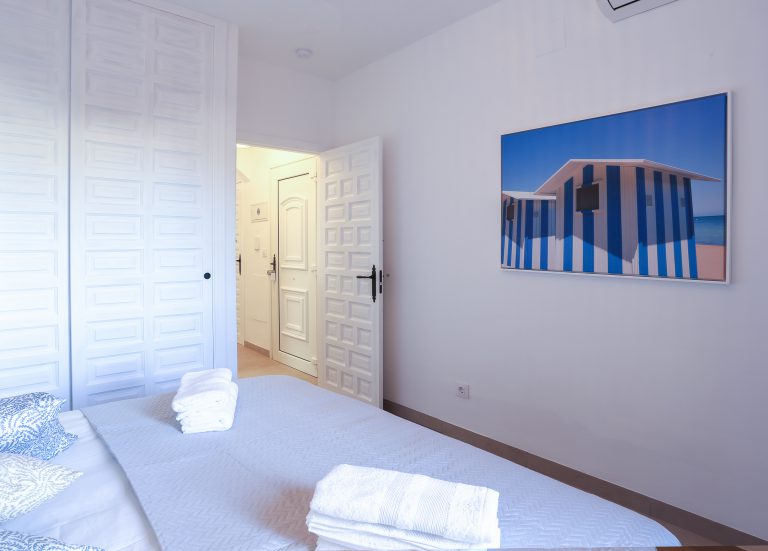 Bedroom with double bed at apartment Alquería Sol in Dénia