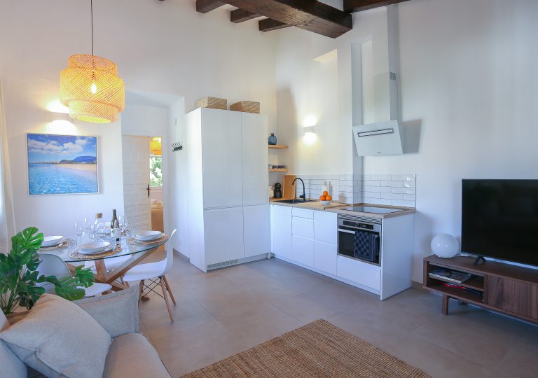 Living room with sofa and dining area at apartment Montesol in Dénia
