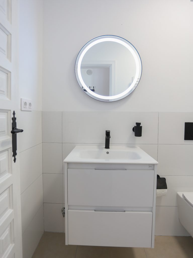 Bathroom with sink and mirror at apartment Montesol in Dénia