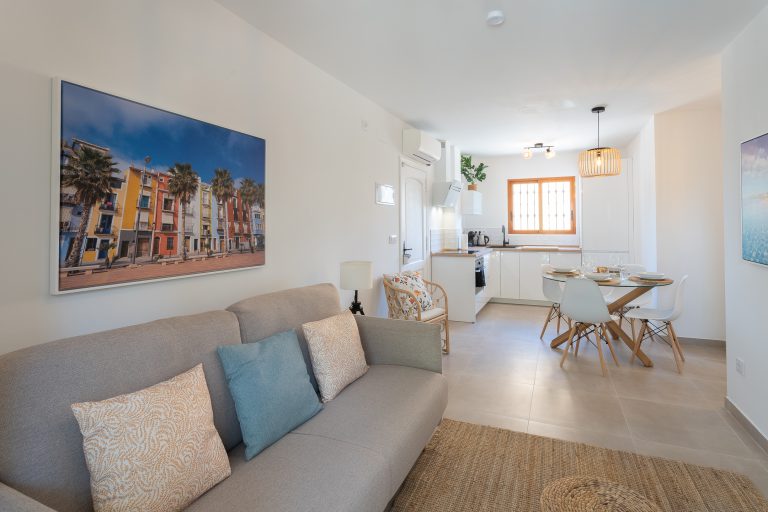 Living room and dining area at apartment El Patio in Dénia