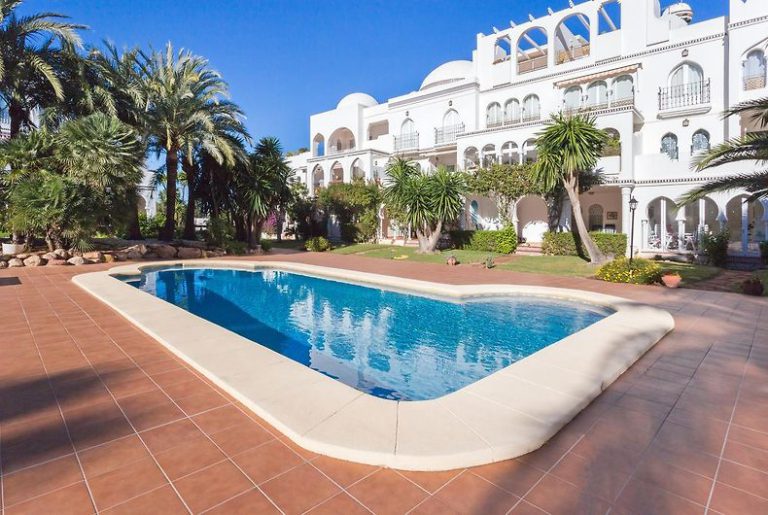Pool area with Mediterranean buildings at apartment Al Khalif 2 near Dénia