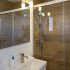 Bathroom with walk-in shower at apartment Retiro Sol A05 in Dénia