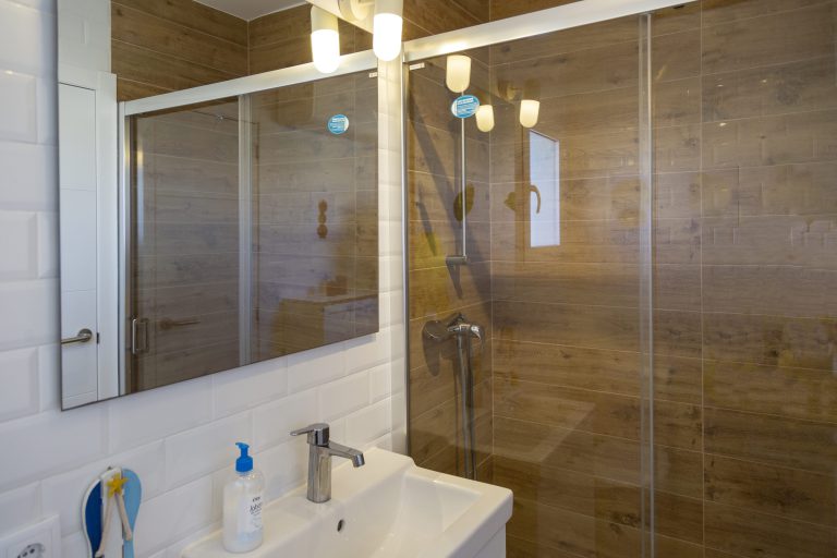Bathroom with walk-in shower at apartment Retiro Sol A05 in Dénia