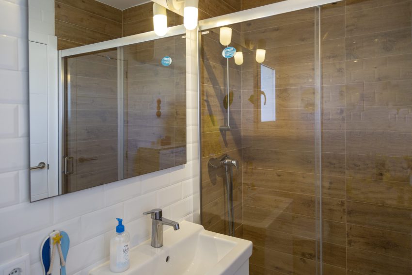Bathroom with walk-in shower at apartment Retiro Sol A05 in Dénia