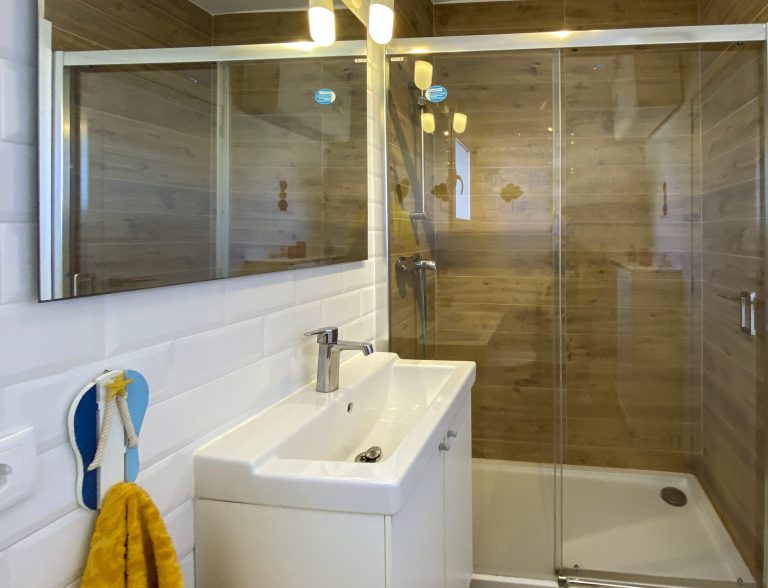 Bathroom with toilet and storage cabinet at apartment Retiro Sol A05 in Dénia