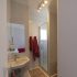 Bathroom with shower and red towels at apartment Retiro Sol A09 in Dénia