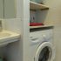 Bathroom with sink and washing machine at apartment Retiro Sol A09 in Dénia