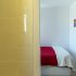 Bedroom with single bed at apartment Retiro Sol A09 in Dénia