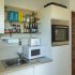 Kitchen with cabinets and appliances at apartment Retiro Sol A09 in Dénia